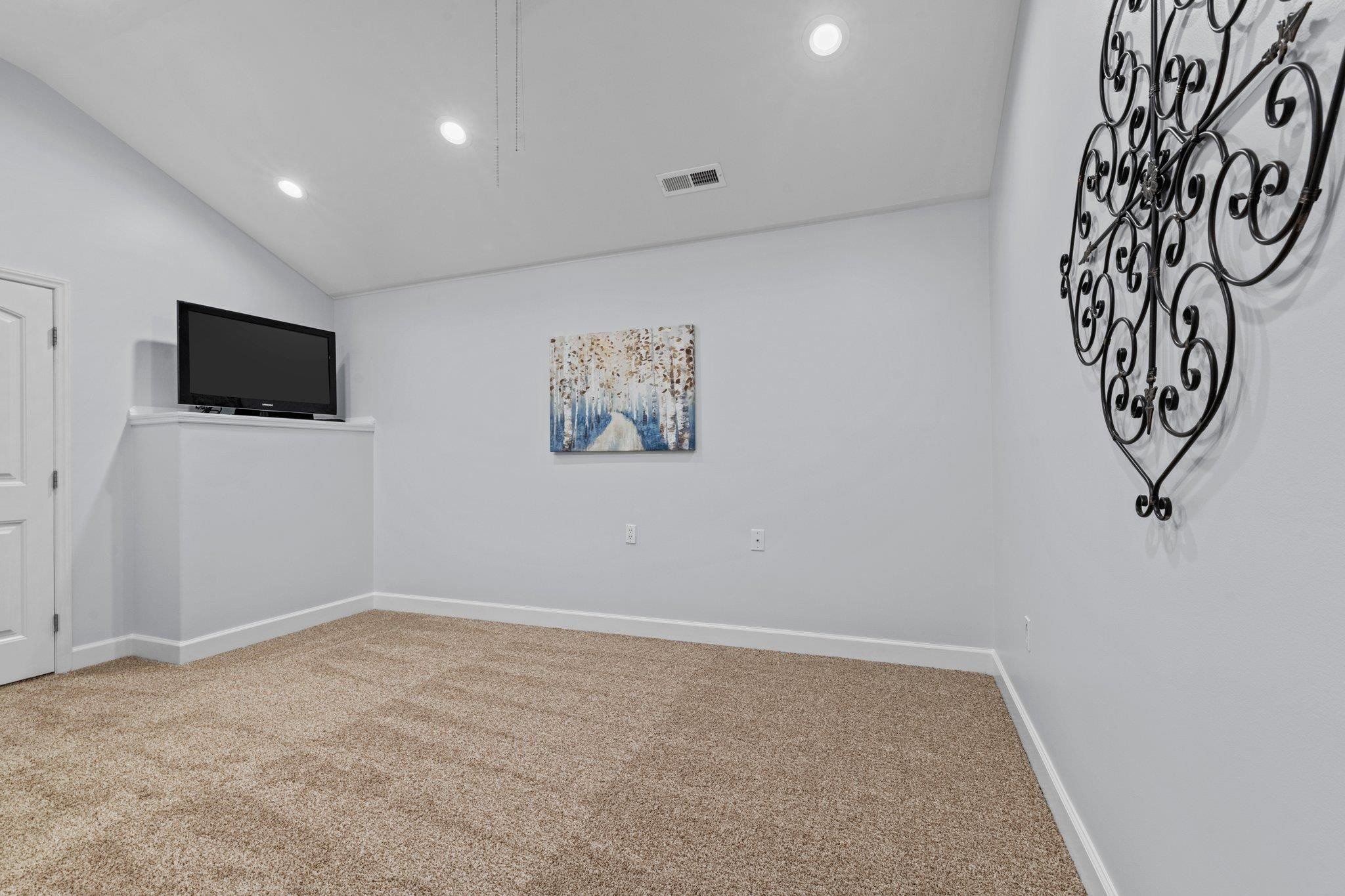 525 Eatmon Road Zebulon, NC 27597 - Photo 23 of 30 Bedroom in apartment above the garage with television niche. Apartment Bedroom