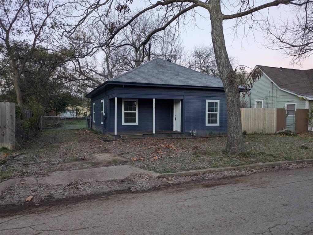 205 North Wood Street Cleburne, TX 76033 - Photo 1 of 15 a view of a house with a yard