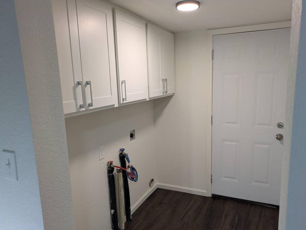 205 North Wood Street Cleburne, TX 76033 - Photo 13 of 15 a view of hallway with closet