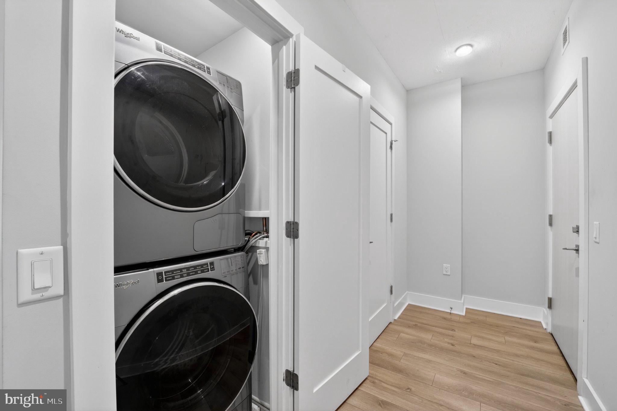 88 V Street Southwest, Unit 213 Washington, DC 20024 - Photo 7 of 26 Modern laundry nook with sleek appliances.