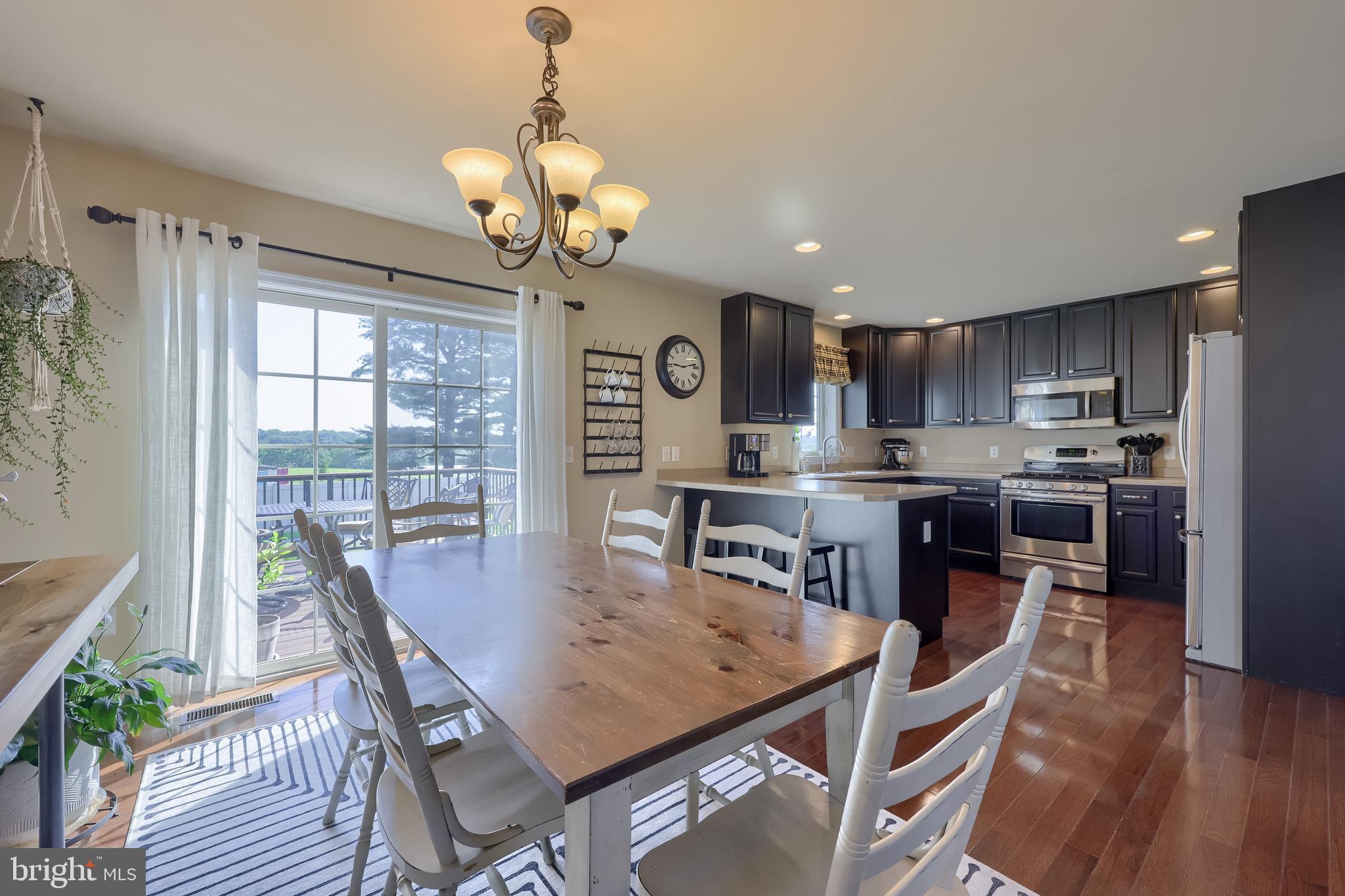 631 Owl Hill Road Lititz, PA 17543 - Photo 12 of 56 a view of a dining room with furniture window and wooden floor