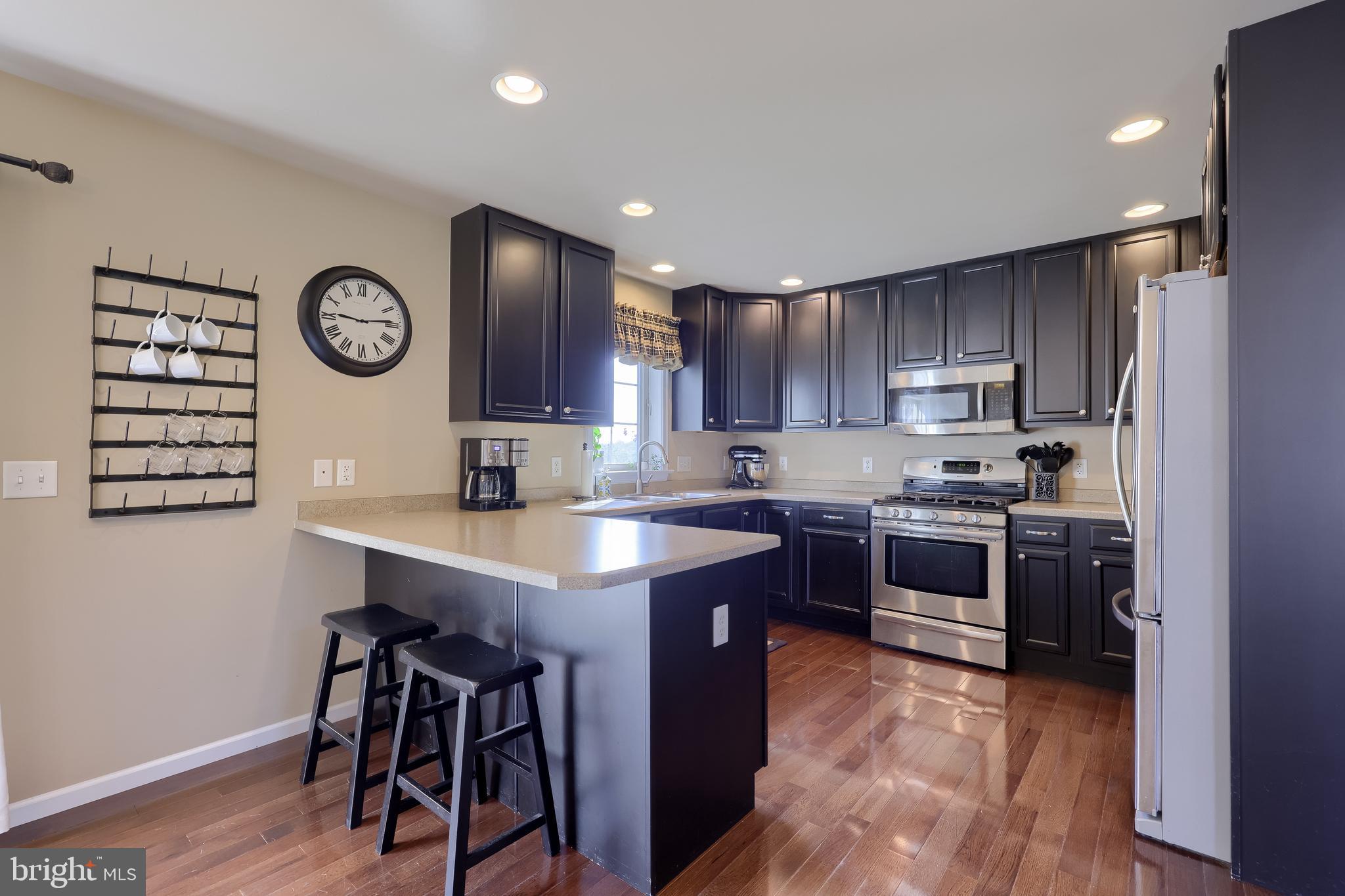631 Owl Hill Road Lititz, PA 17543 - Photo 13 of 56 a kitchen with kitchen island granite countertop wooden cabinets and stainless steel appliances
