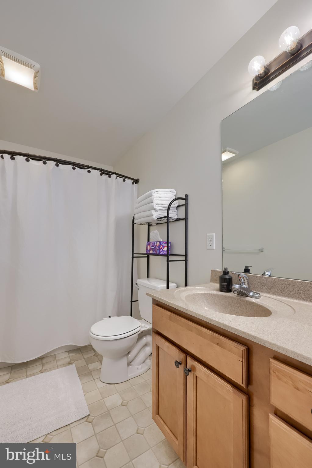 631 Owl Hill Road Lititz, PA 17543 - Photo 24 of 56 a bathroom with a sink toilet vanity and mirror