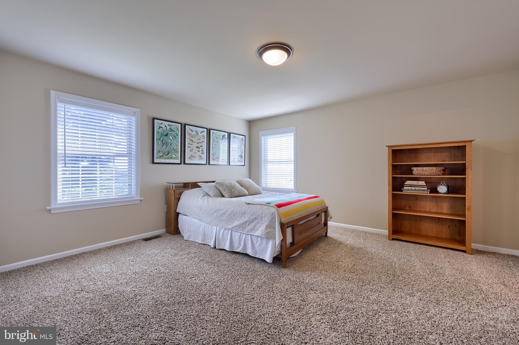 631 Owl Hill Road Lititz, PA 17543 - Photo 38 of 56 a spacious bedroom with a bed and a window