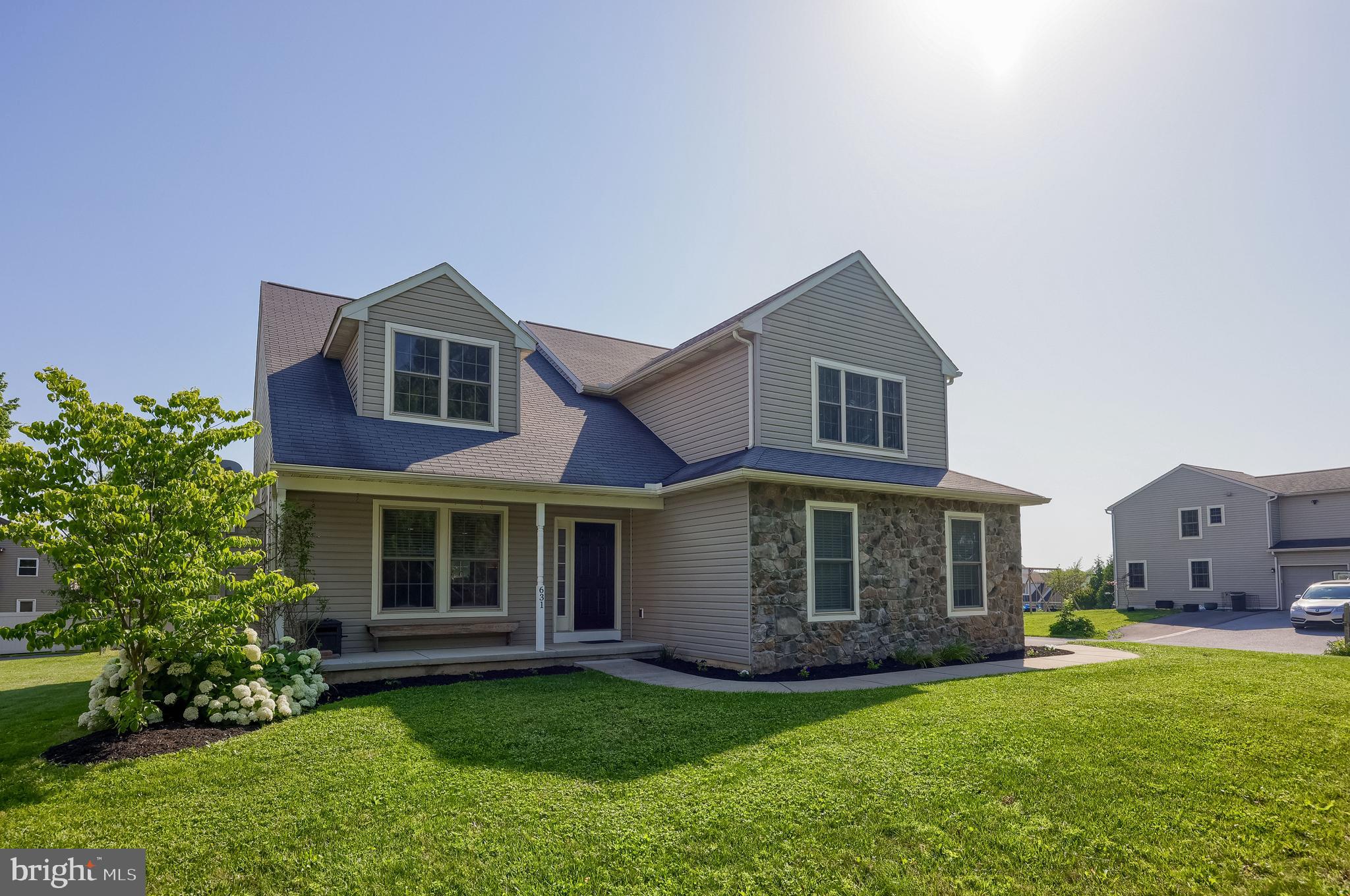 631 Owl Hill Road Lititz, PA 17543 - Photo 54 of 56 a front view of a house with a garden and porch