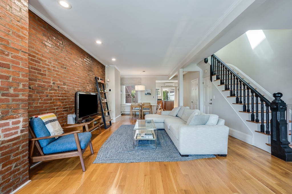 39 Emerson Street Boston, MA 02127 - Photo 2 of 20 a living room with fireplace furniture and a flat screen tv