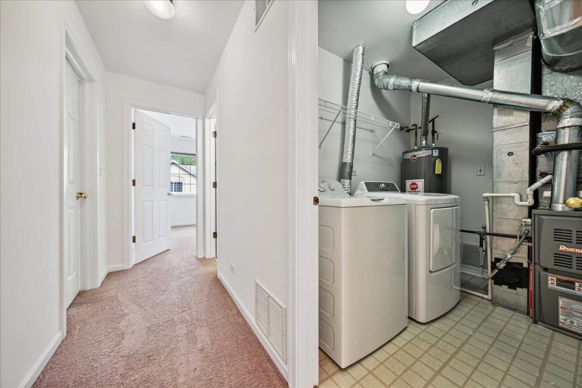 973 Park Hill Circle, Unit 973 Aurora, IL 60502 - Photo 16 of 17 a view of a storage & utility room with washer and dryer