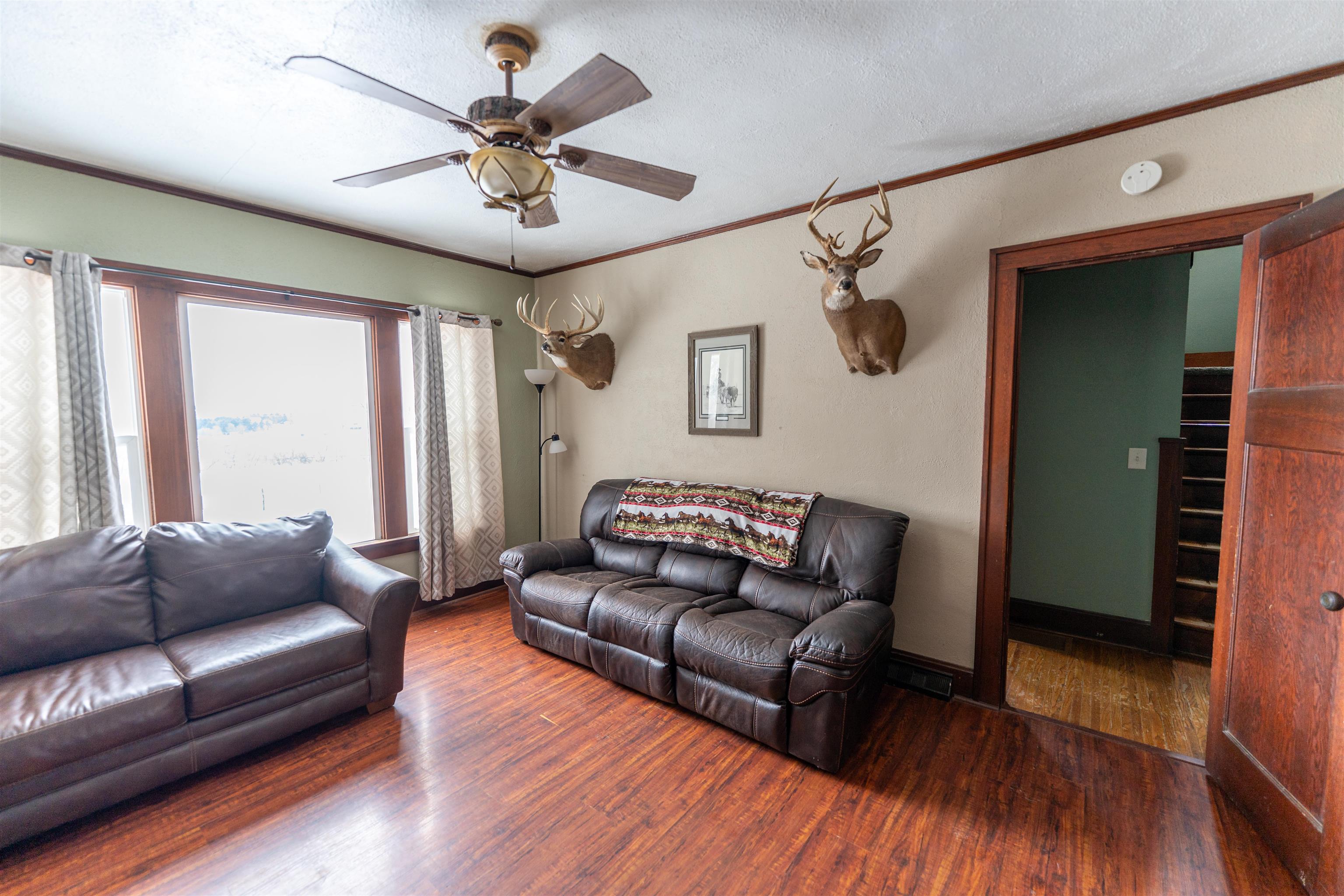 7965 North Adeline Road Leaf River, IL 61047 - Photo 18 of 90 a living room with furniture and a wooden floor