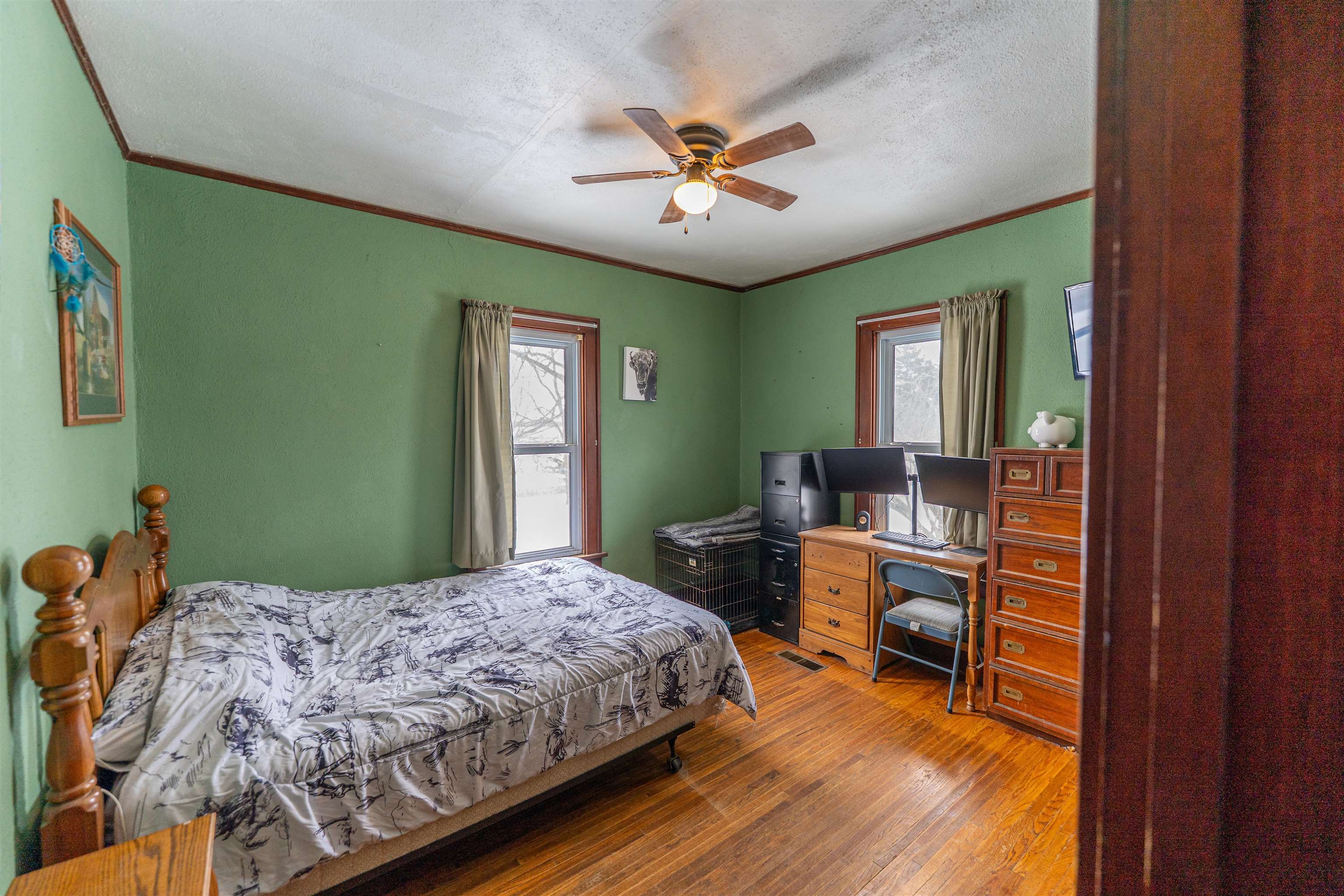 7965 North Adeline Road Leaf River, IL 61047 - Photo 22 of 90 a bedroom with a bed and a chandelier