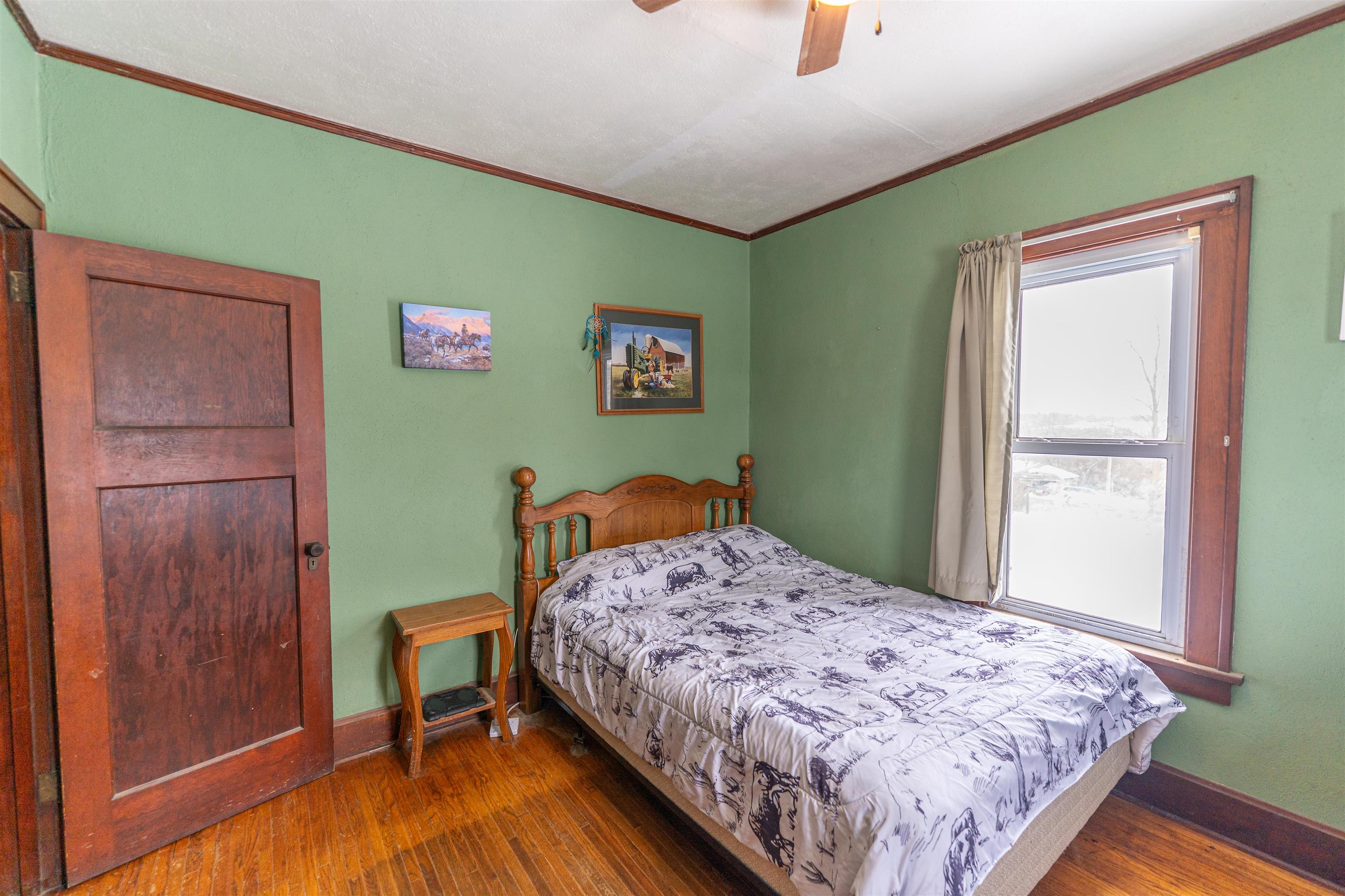 7965 North Adeline Road Leaf River, IL 61047 - Photo 23 of 90 a bedroom with a bed and a window