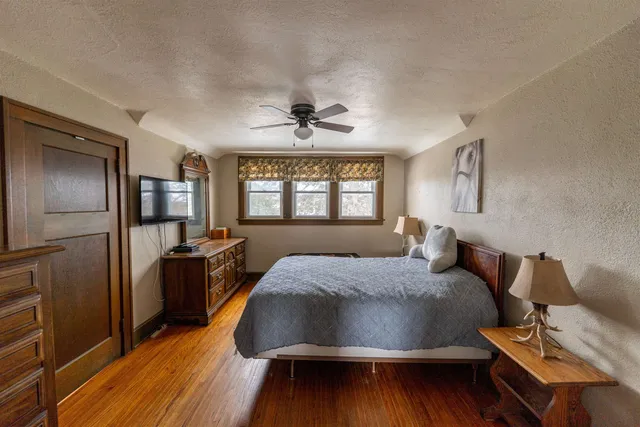 a view of a house with wooden fence