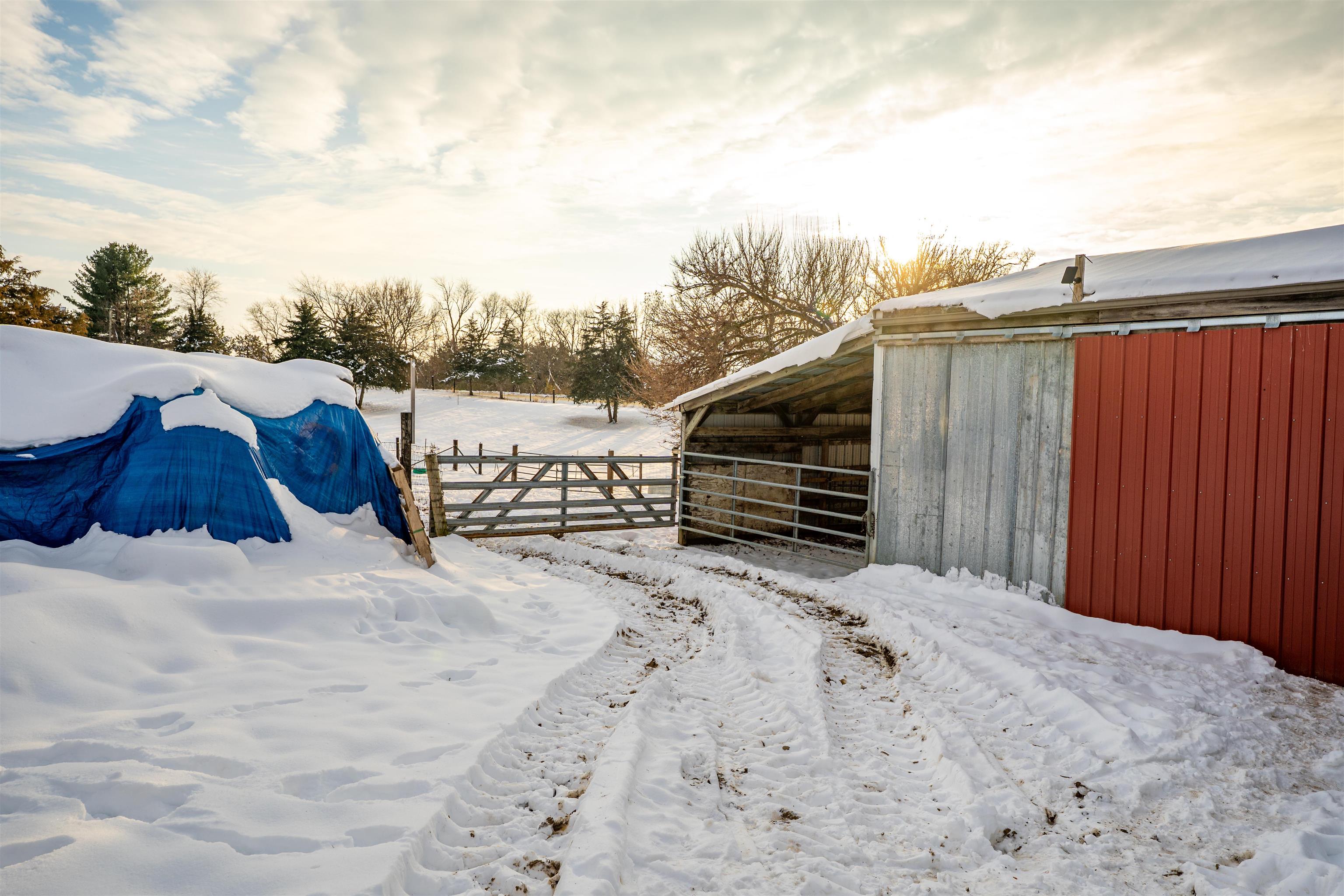7965 North Adeline Road Leaf River, IL 61047 - Photo 44 of 90 a view of a house with wooden fence
