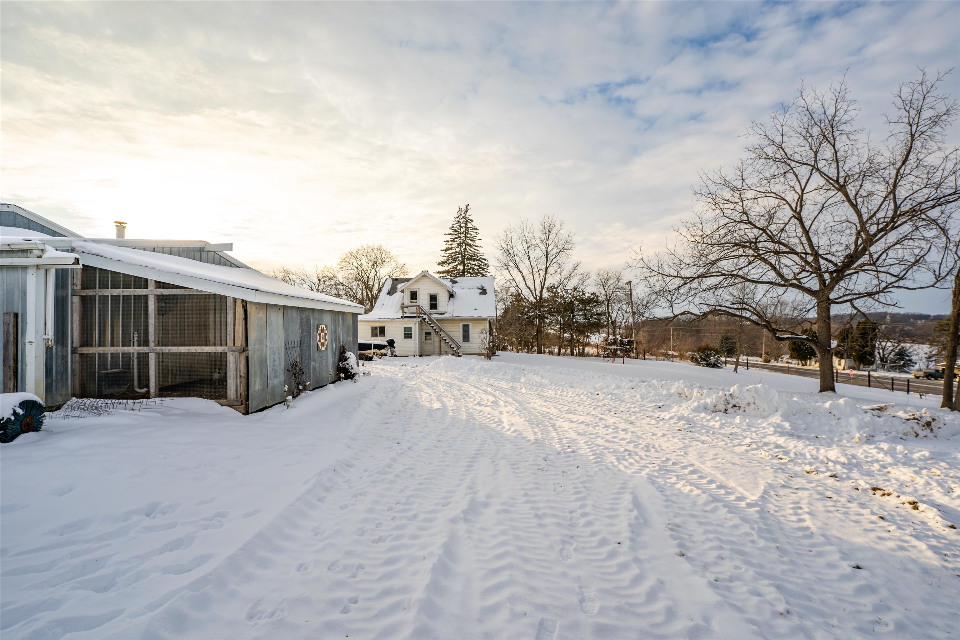 7965 North Adeline Road Leaf River, IL 61047 - Photo 48 of 90 a view of large house with a yard covered in snow