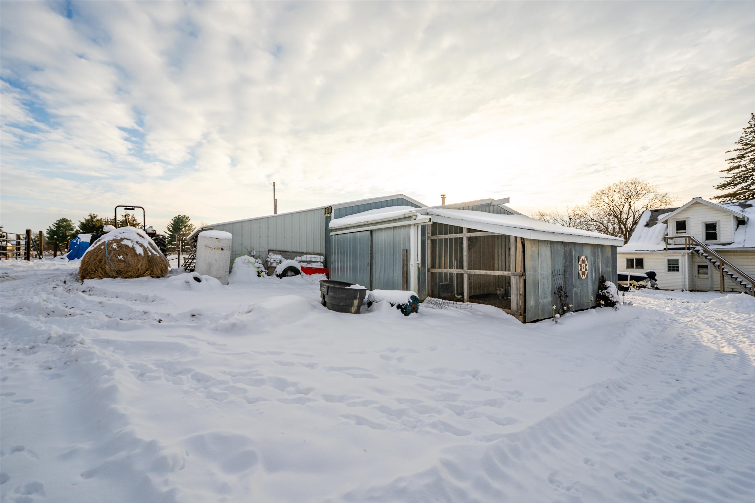 7965 North Adeline Road Leaf River, IL 61047 - Photo 49 of 90 a view of a house with cars in front of it