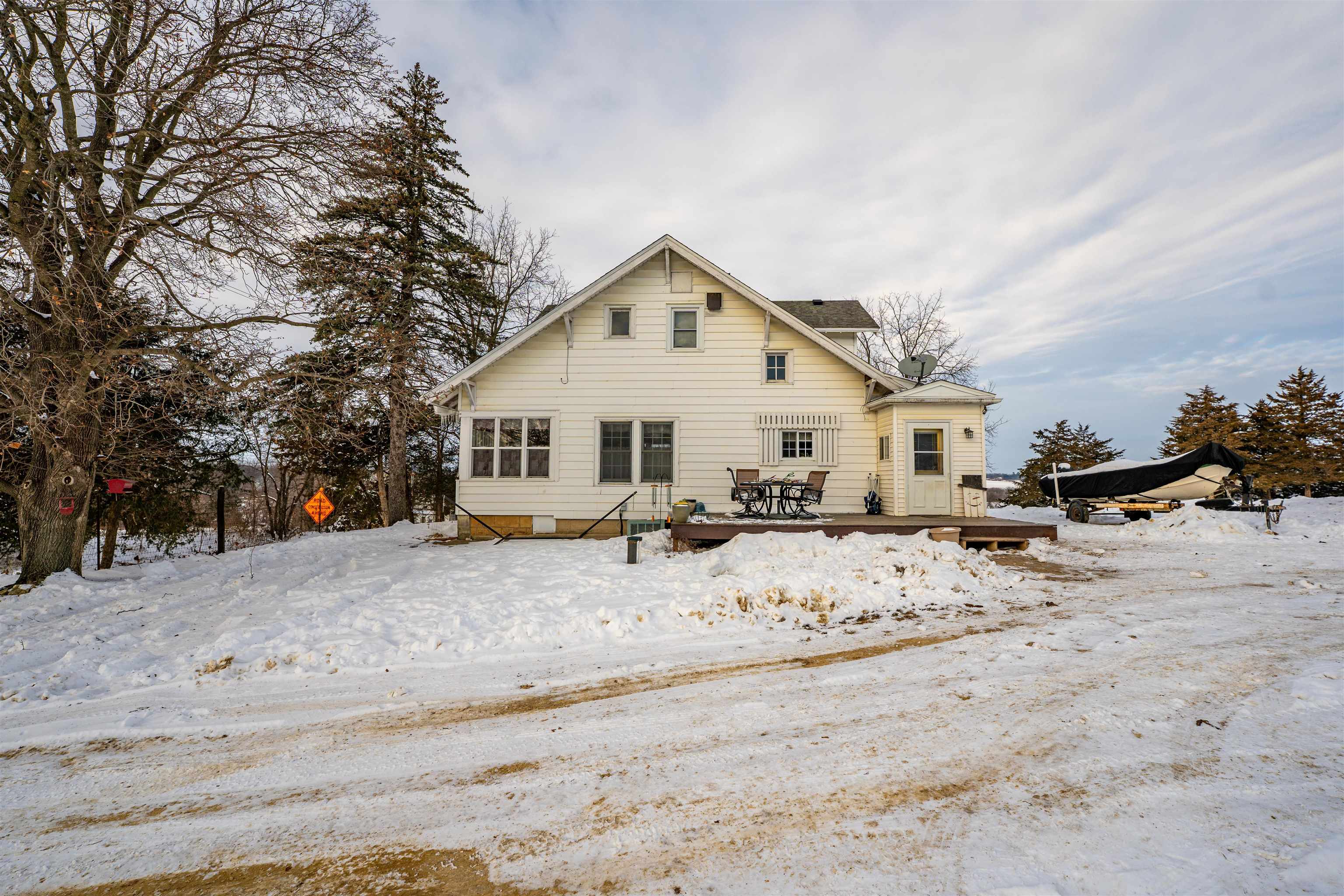 7965 North Adeline Road Leaf River, IL 61047 - Photo 58 of 90 a view of a house with a yard covered in snow