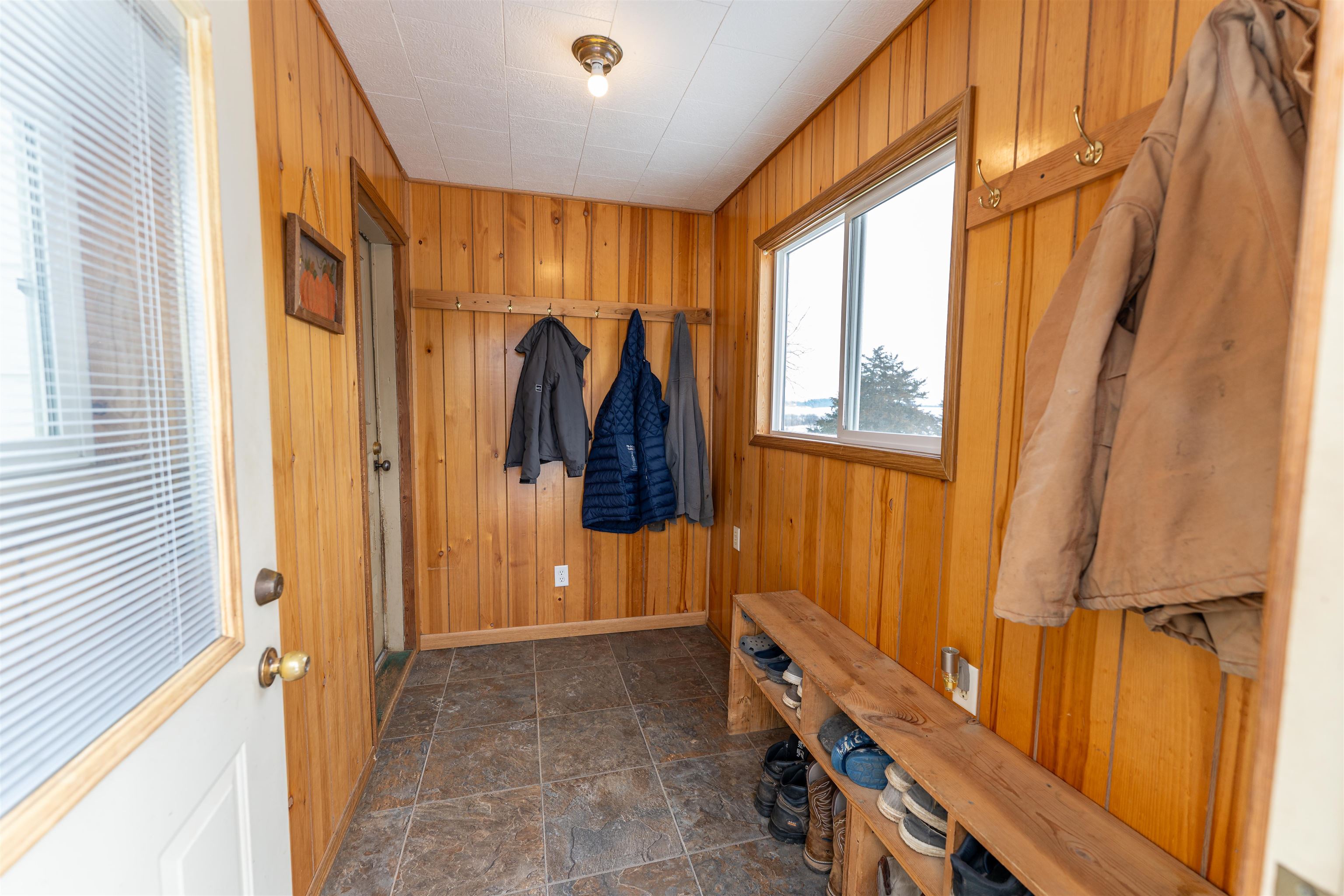 7965 North Adeline Road Leaf River, IL 61047 - Photo 6 of 90 a view of walk in closet with clothes and shoes