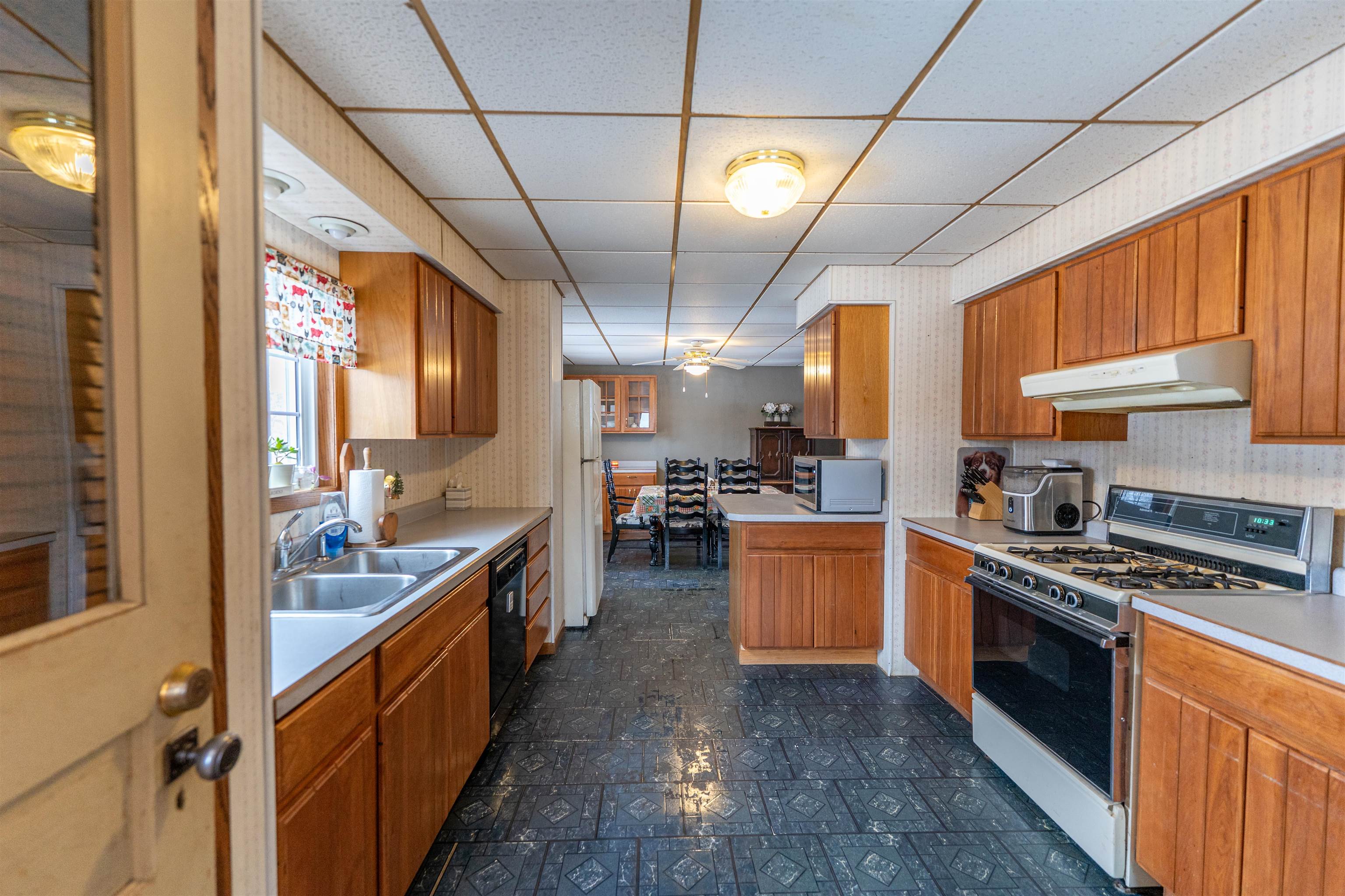 7965 North Adeline Road Leaf River, IL 61047 - Photo 8 of 90 a large kitchen with stainless steel appliances granite countertop lots of counter top space