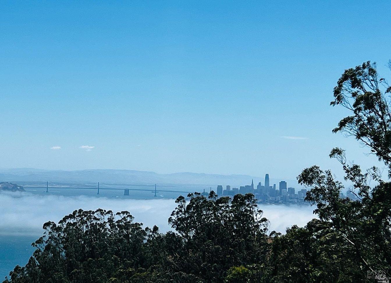 a view of a large body of water with a building in the background