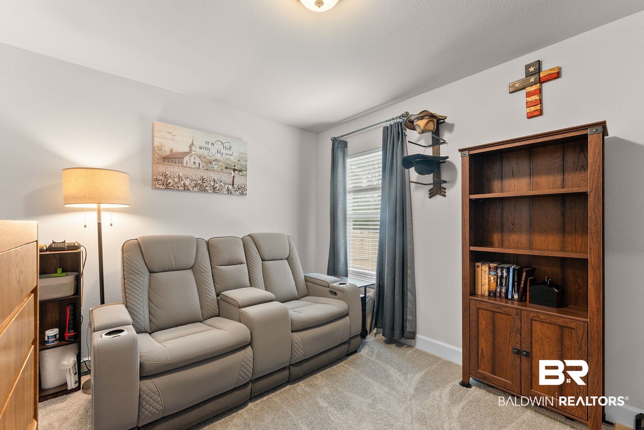 692 Mayflower Drive Foley, AL 36535 - Photo 17 of 40 Living area featuring light carpet and baseboards