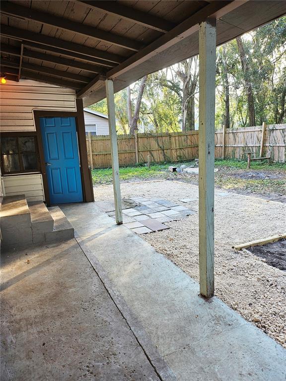 10250 Southeast 108th Terrace Road Ocala, FL 34472 - Photo 11 of 11 a view of a patio door and a yard