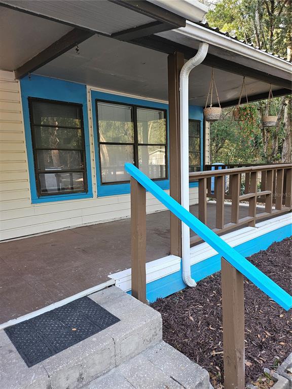 10250 Southeast 108th Terrace Road Ocala, FL 34472 - Photo 2 of 11 a house view with a backyard space