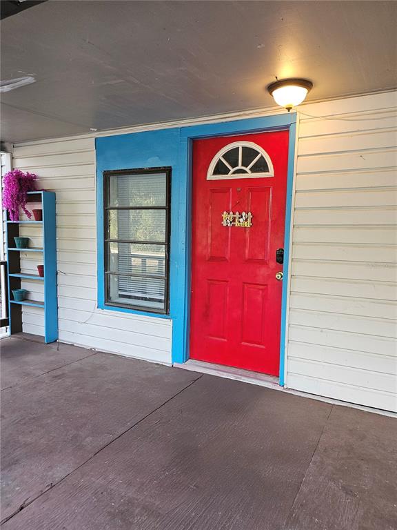 10250 Southeast 108th Terrace Road Ocala, FL 34472 - Photo 3 of 11 a view of a red door and an empty space