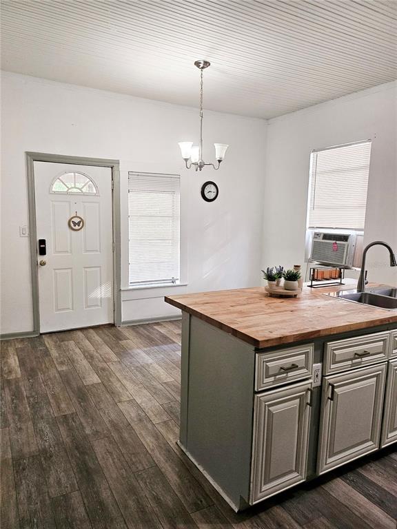10250 Southeast 108th Terrace Road Ocala, FL 34472 - Photo 6 of 11 a kitchen with stainless steel appliances granite countertop a sink and a stove with wooden floors