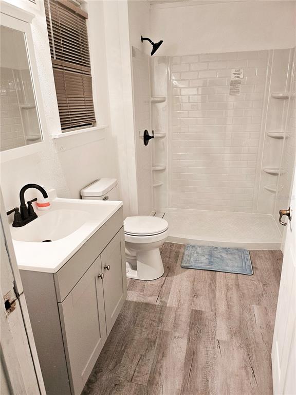 10250 Southeast 108th Terrace Road Ocala, FL 34472 - Photo 9 of 11 a bathroom with a sink a toilet and shower