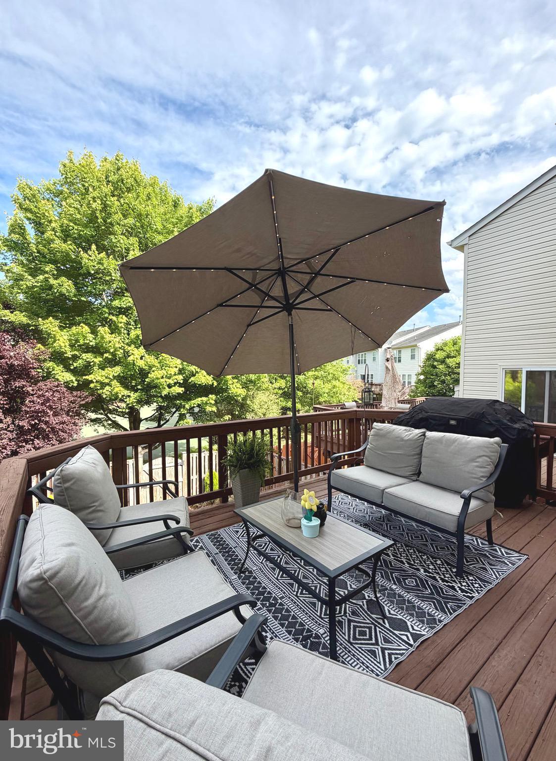 7108 Wheeling Way Gainesville, VA 20155 - Photo 17 of 45 a view of a patio with couches table and chairs