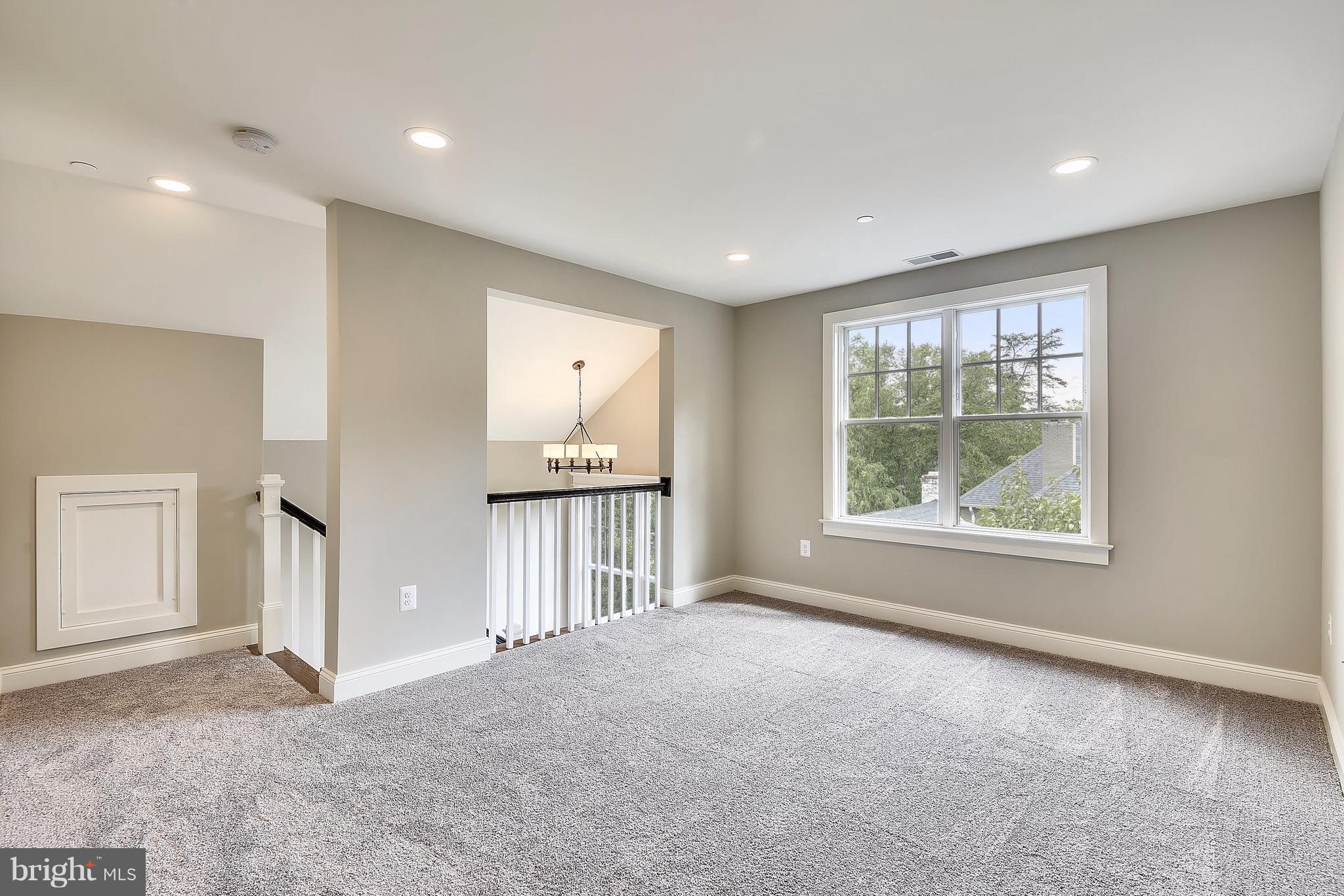 7810 Custer Road Bethesda, MD 20814 - Photo 20 of 30 a view of an empty room with a window