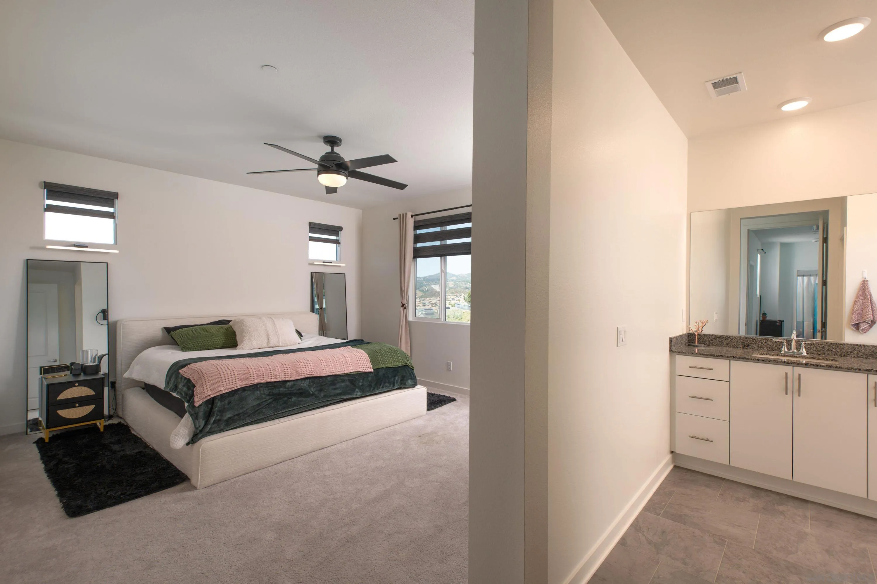 35177 Orchard Trail Fallbrook, CA 92028 - Photo 16 of 31 a bedroom with a bed and a chandelier