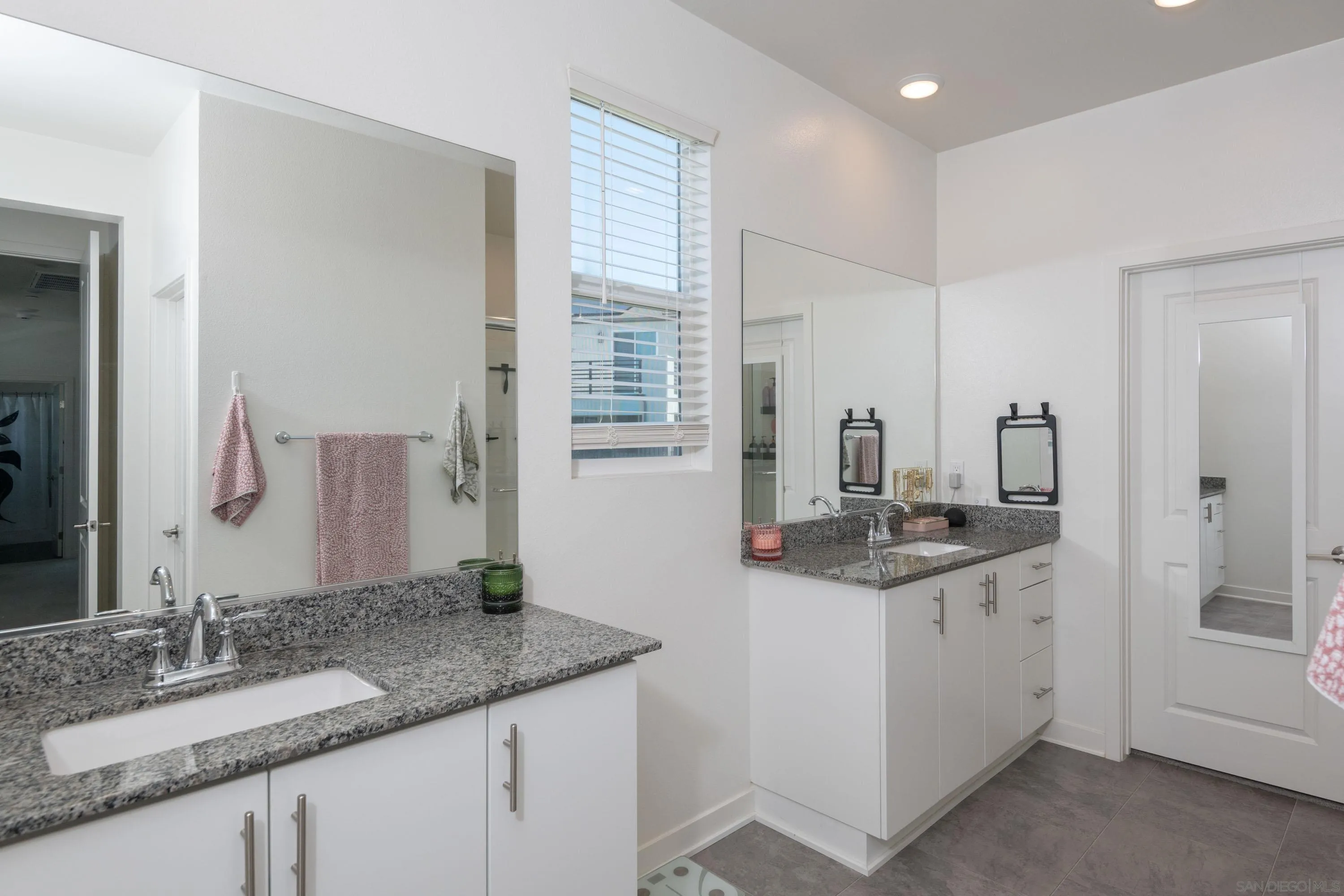 35177 Orchard Trail Fallbrook, CA 92028 - Photo 17 of 31 a bathroom with a granite countertop sink and a mirror