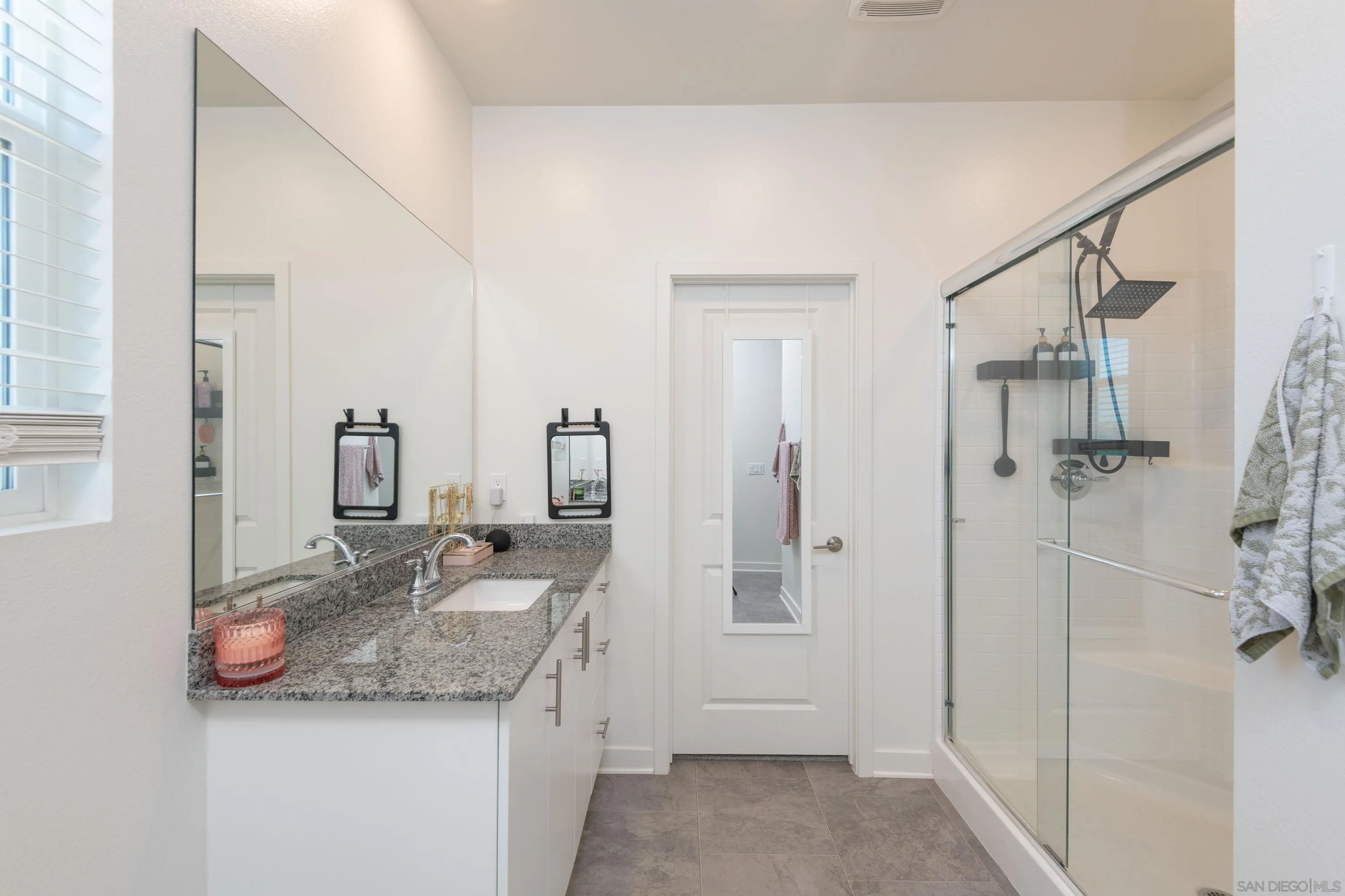 35177 Orchard Trail Fallbrook, CA 92028 - Photo 18 of 31 a bathroom with a granite countertop sink and a mirror