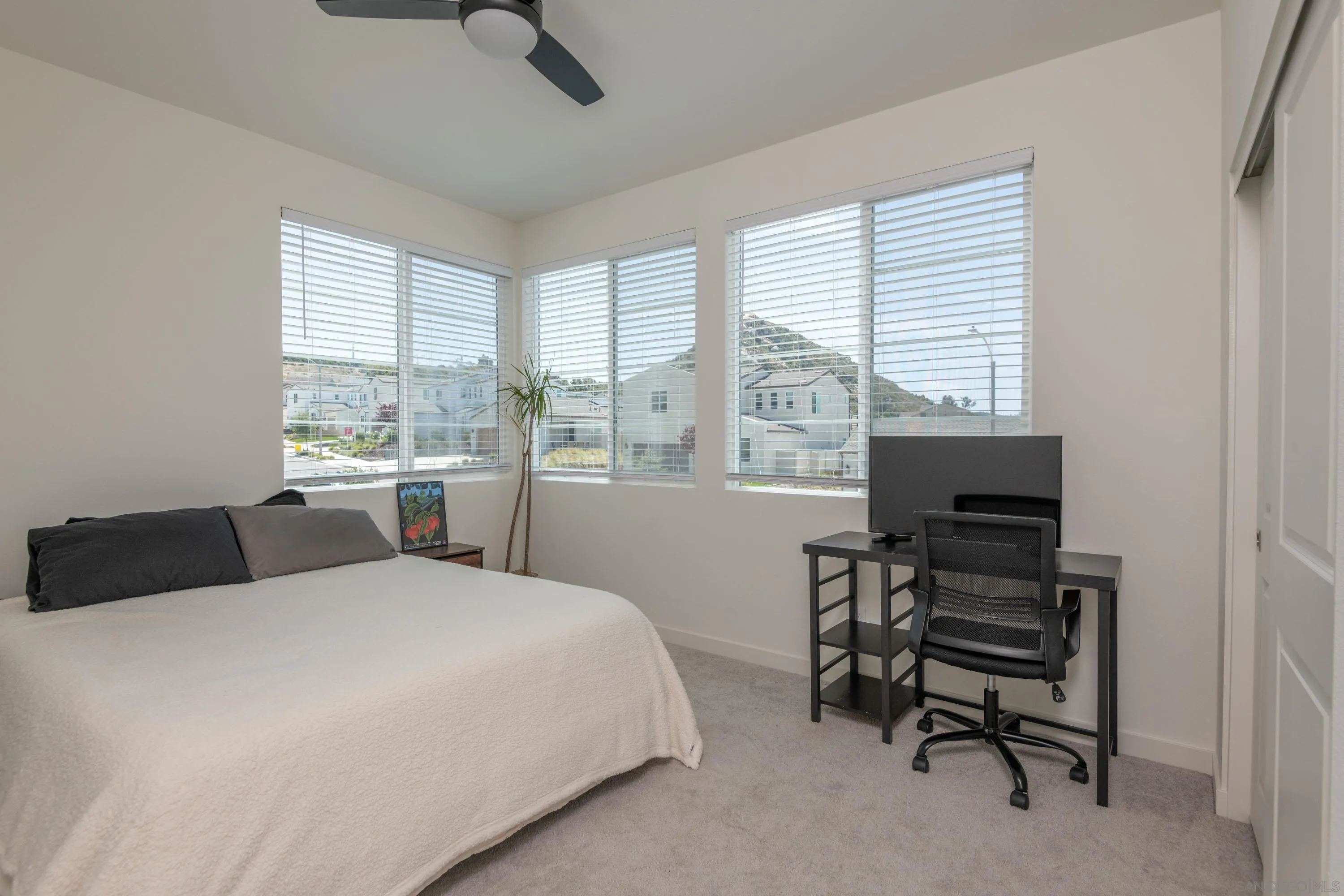 35177 Orchard Trail Fallbrook, CA 92028 - Photo 20 of 31 a bedroom with a bed and a desk