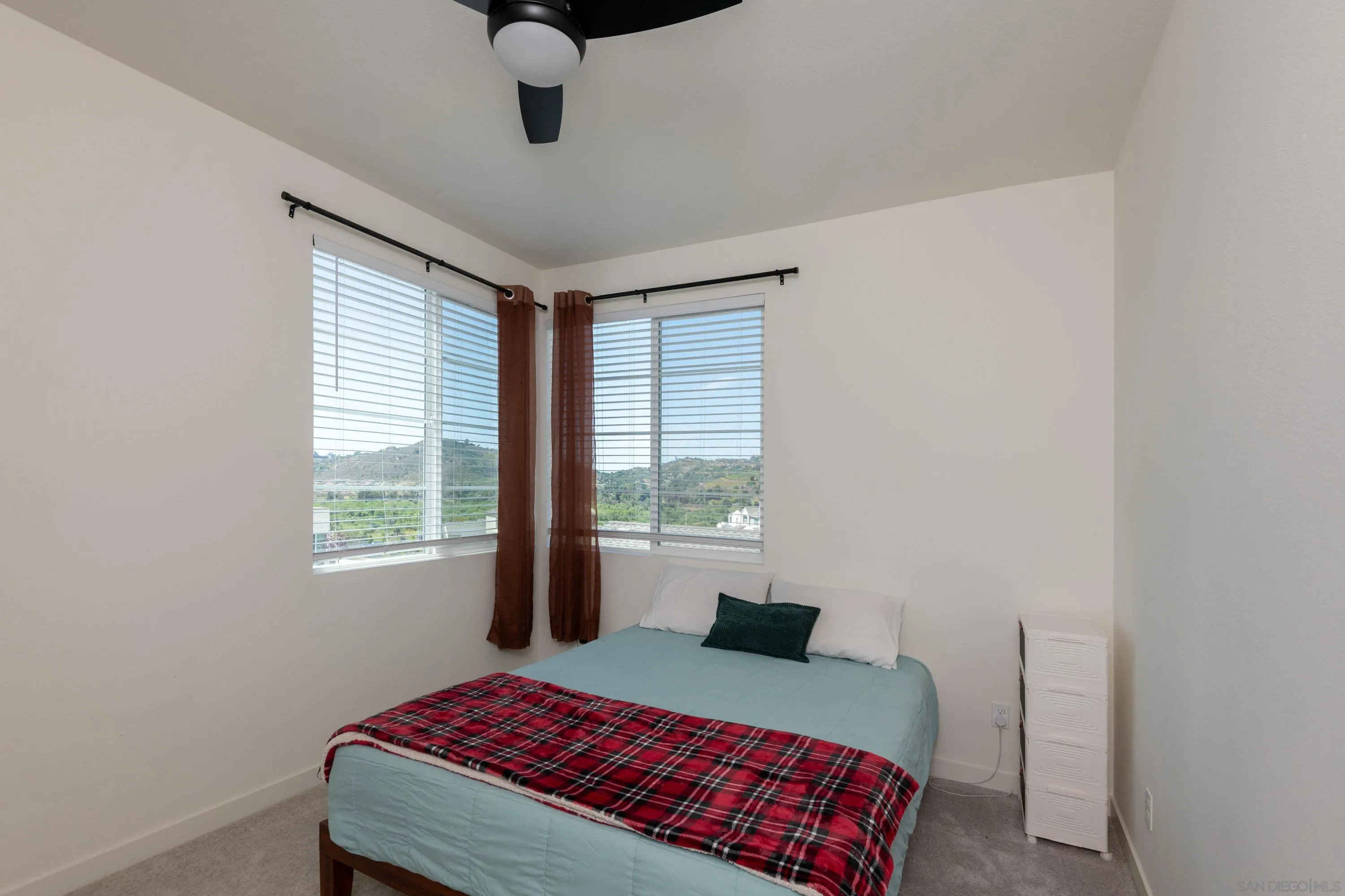 35177 Orchard Trail Fallbrook, CA 92028 - Photo 21 of 31 a bedroom with a bed and window