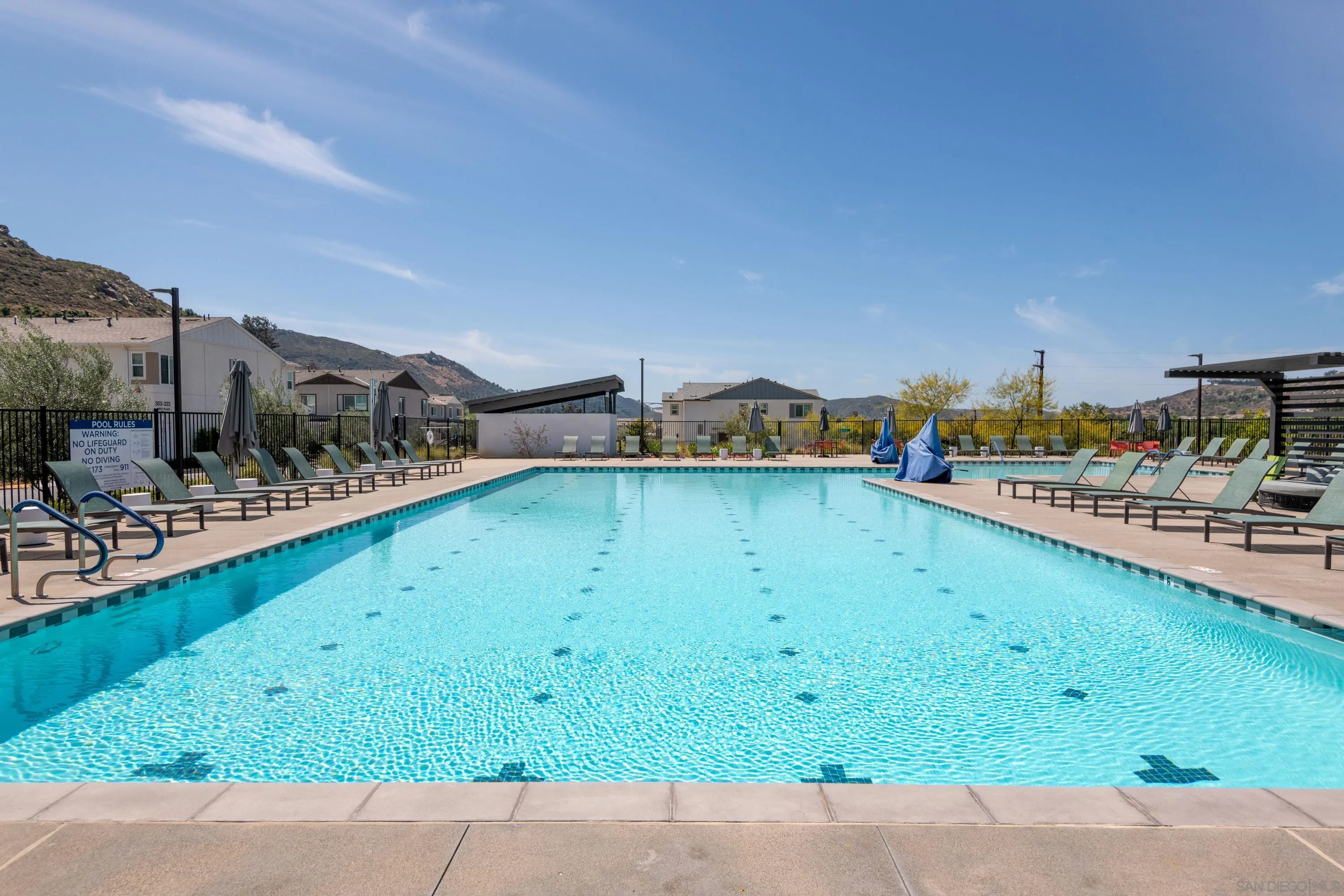 35177 Orchard Trail Fallbrook, CA 92028 - Photo 29 of 31 a view of a swimming pool with an outdoor seating and a yard