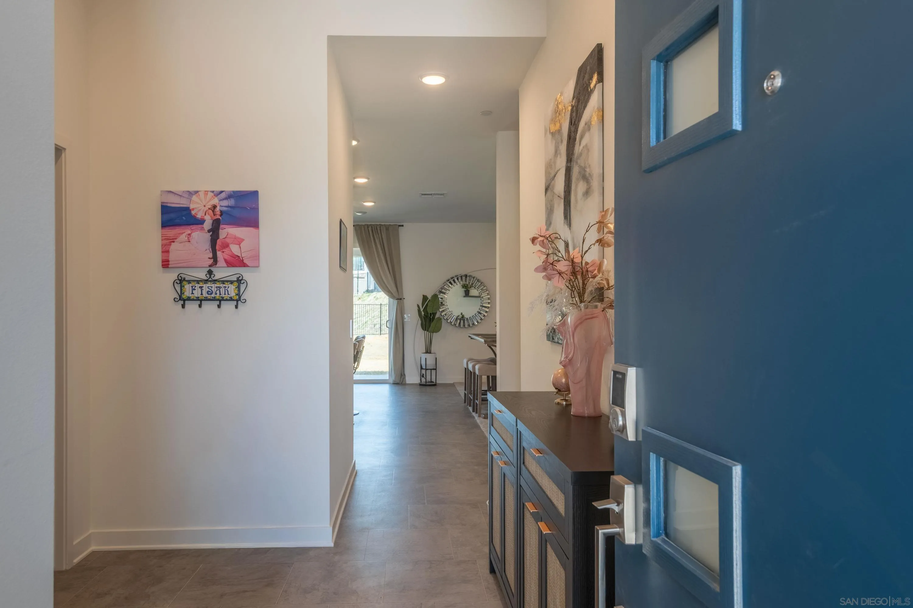 35177 Orchard Trail Fallbrook, CA 92028 - Photo 4 of 31 a view of a hallway with paintings on the wall
