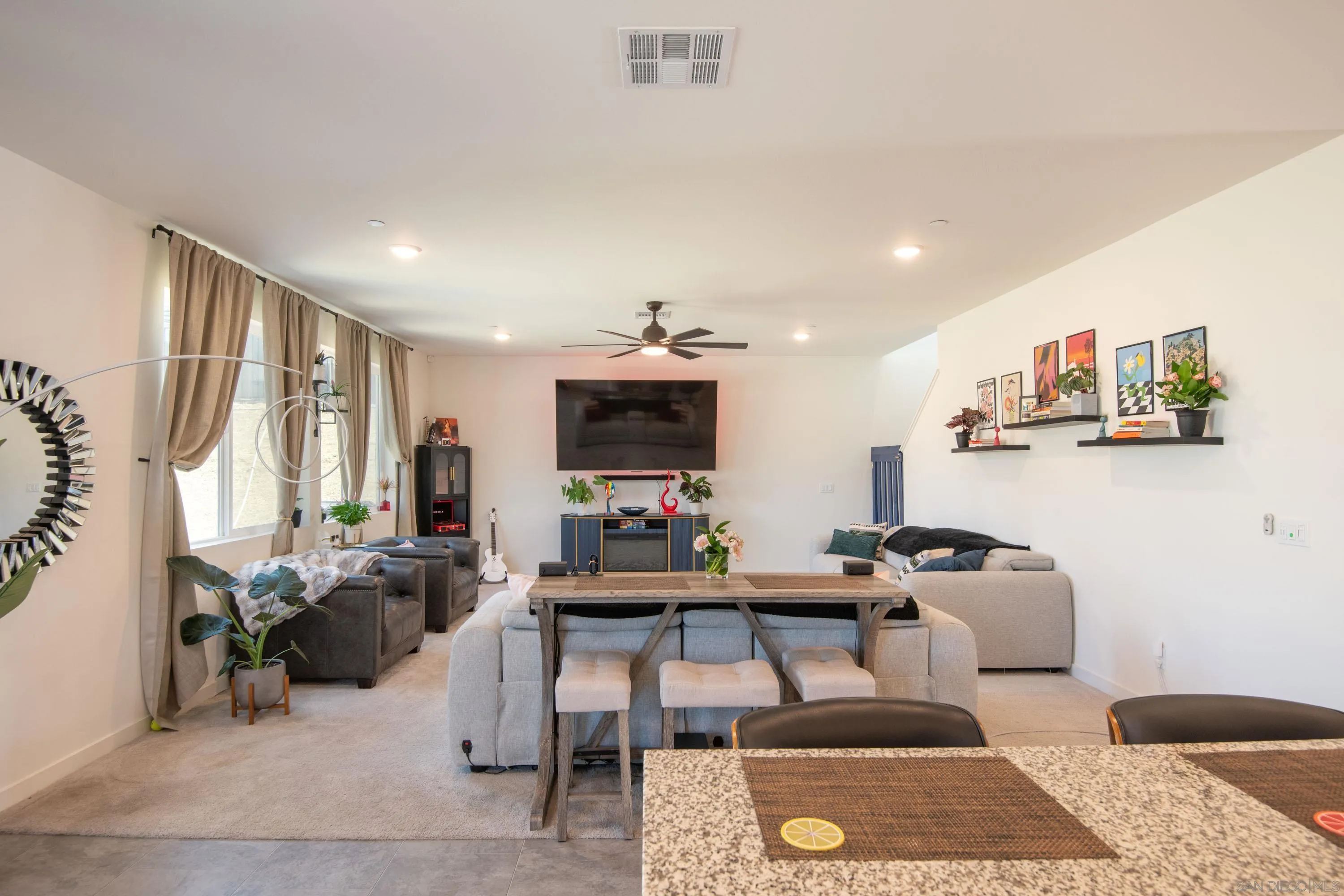 35177 Orchard Trail Fallbrook, CA 92028 - Photo 9 of 31 a room with furniture a rug and a flat screen tv