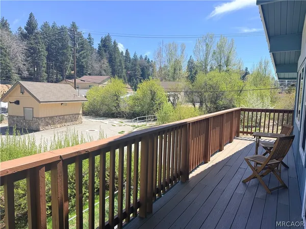 a view of a two chairs on the roof deck