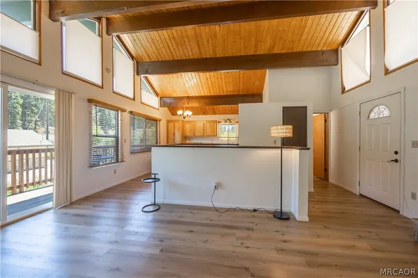 a view of a room with wooden floor