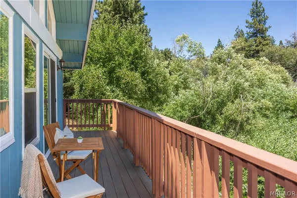 a view of a balcony with wooden floor