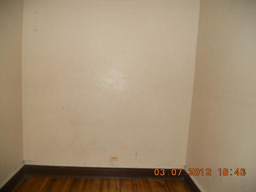 7108 South Normal Boulevard Chicago, IL 60621 - Photo 14 of 15 a view of small space with empty racks on the wall