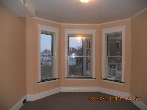 7108 South Normal Boulevard Chicago, IL 60621 - Photo 9 of 15 a view of a door and a window