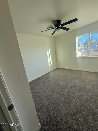 a view of a hallway with a window