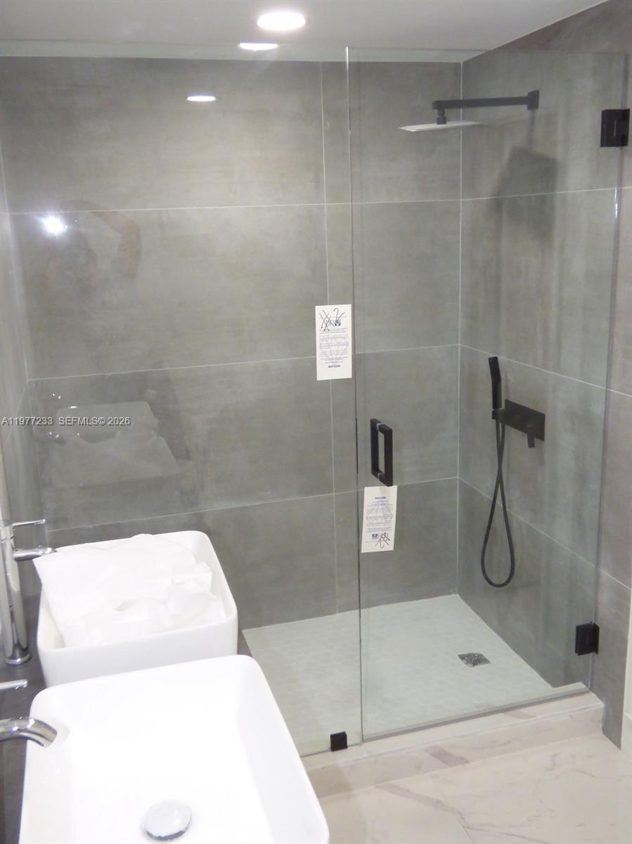5643 North Park Road Dania Beach, FL 33312 - Photo 4 of 9 a bathroom with a shower and toilet