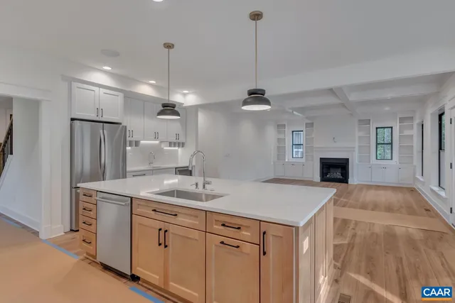 a bathroom with a sink toilet and a mirror