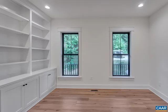 a view of room with walk in closet and empty room