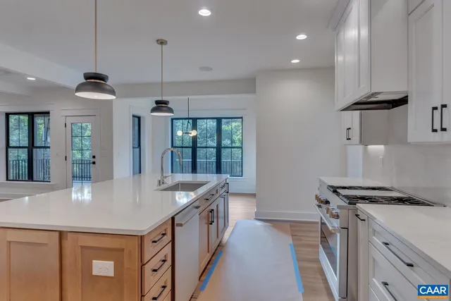 a kitchen with a refrigerator and a sink