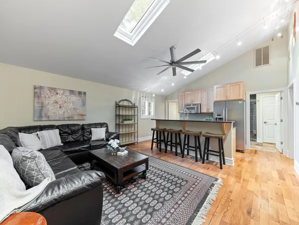 a living room with furniture and a rug