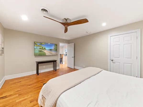 a bedroom with a bed and a dresser